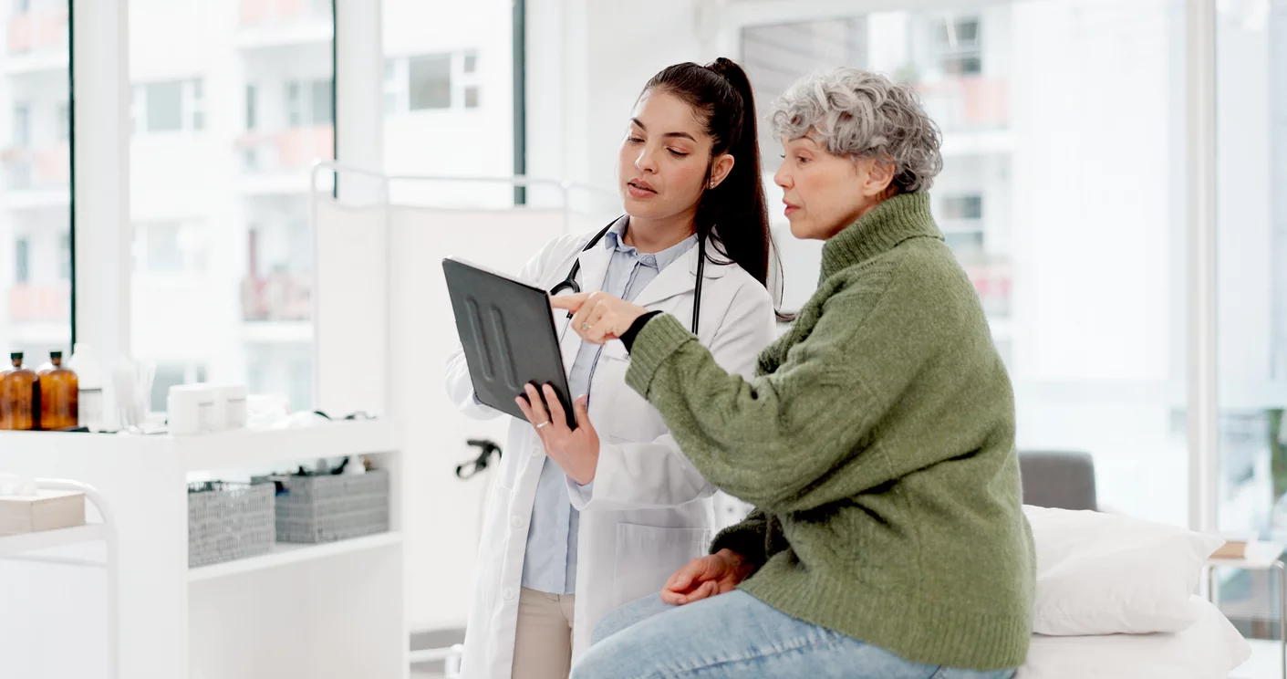 old woman or doctor shaking hands with patient