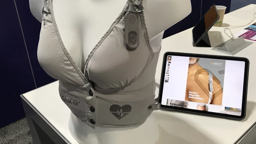 This is a wearable defibrillator vest for patients at risk of sudden cardiac arrest who may not need a permanent implantable cardioverter defibrillator (ICD), or who are waiting to get one. The Kestra Medical Technologies vest is the second wearable defibrillator on the market, in addition to the Zoll vest. The Kestra vest used feedback from doctors to develop vests specific to men and women for better comfort and fit. It has built-in 6-lead ECG sensors sewn into the vest. It gained FDA in 2021. #ACC22