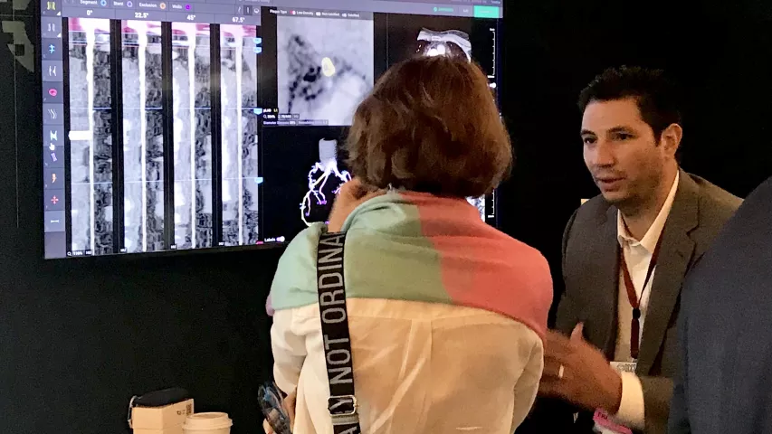 Discussion on the expo floor on how artificial intelligence can help assess coronary soft plaque. #SCCT #SCCT2022 #AI
