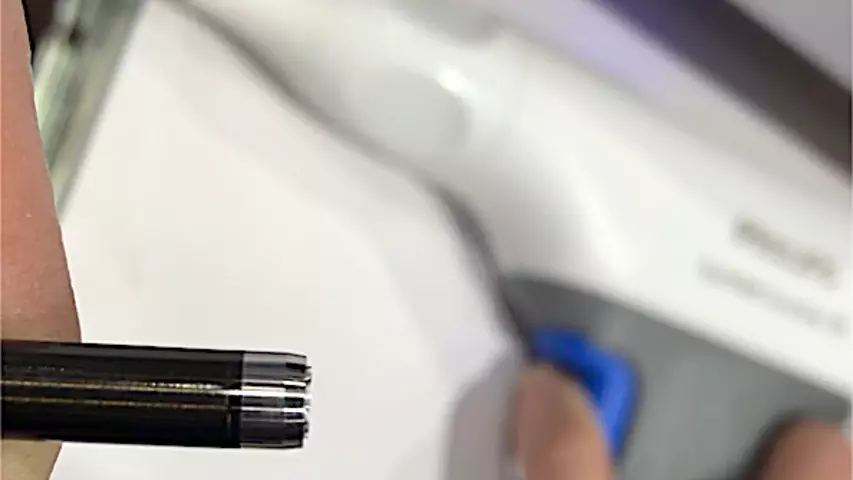 Image showing the 0.4 mm extension of the blade from its sheath on the Philips Healthcare TightRail Guardian lead extraction system for electrophysiology. The short extension of the blade aids safety. The system is powered like a drill so the operator does not have to hand-actuate the trigger hundreds of times to cut through the scar tissue adhesions on EP device leads. This can make the lead management procedures faster.