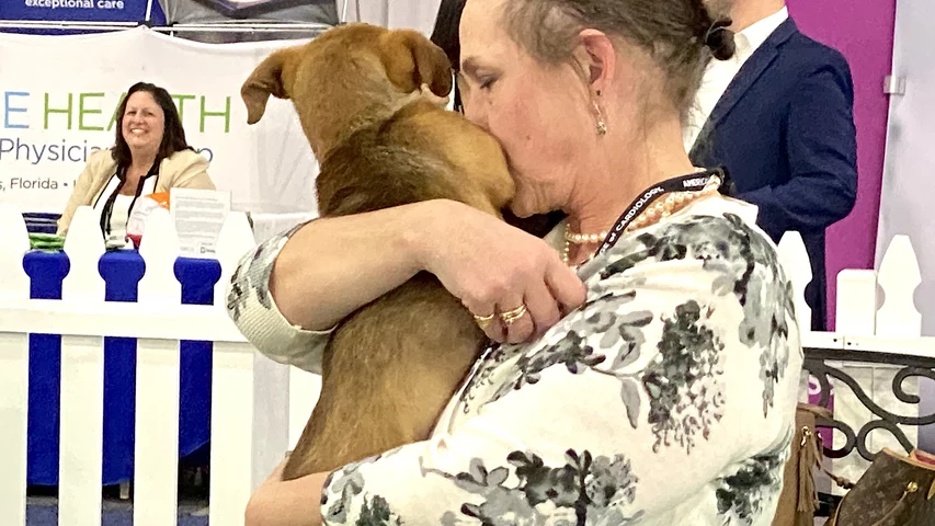 ACC.24 attendees had the chance to hold and pet puppies on the expo floor, sponsored by Boston Scientific.