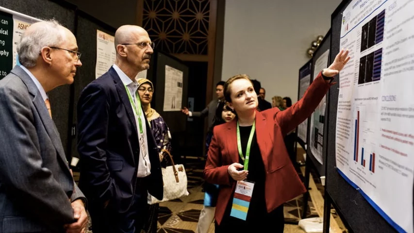 Marcelo DiCarli, MD, chief of the division of nuclear medicine and molecular imaging and executive director for the cardiovascular imaging program at Brigham and Women's Hospital, listens to a poster presentation at ASNC 2024. Photo courtesy of ASNC