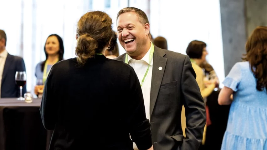 ASNC President Larry Philips in. a conversation with an attendee ASNC 2024. Photo courtesy of ASNC