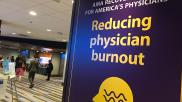 A sign for reducing physician burnout, which was one of the top priorities at the American Medical Association (AMA) 2022 House of Delegates meeting. Photo by Dave Fornell