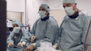 Carlos Collet, MD, PhD, (center) and colleagues perform CT-guided PCI. Image courtesy of CoreAalst. 