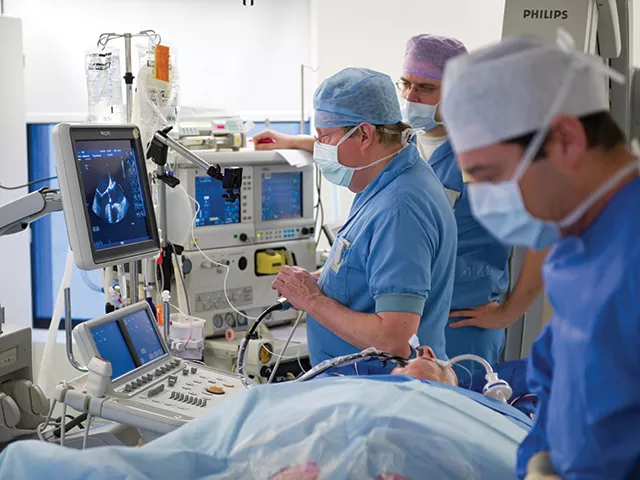Example of an interventional echocardiographer manipulating a transesophageal echo (TEE) probe to help guide a structural heart procedure. Communication between the interventional imager and the interventional cardiologists is key to understanding what is seen in the images. Image courtesy of GE Healthcare 