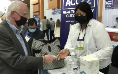 The vaccination verification station at the main entrance into the Washington Convention Center. Stickers were issues after the check that were placed on the attendees badeg to show their vaccination status was verified. This was the first time ACC held an in-person conference since 2019 because of the COVID-19 pandemic. As part of its precautions against the virus to keep the event safe, mandatory proof of COVID vaccinations had to be shown and masks were required throughout the event. #ACC2022