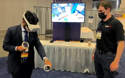 An attendee tried out a virtual realty (VR) training simulator from SimXvr system. VR is being used by a few vendors to now help train clinicians. #ACC22