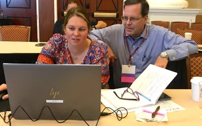 Kelley Branch, MD, MSc, FSCCT, associate director, clinical trials service unit, professor, of medicine, University of Washington Medical Center, helps an attendee learning how to evaluate cardiac CT congenital heart cases. The Congenital Disease Workshop as an all-day pre-conference course to sharpen reading skills for these difficult to interpret cases. #SCCT #SCCT2022 #yesCCT #cardiacCT
