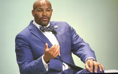 Former U.S. Surgeon General Jerome Adams spoke at the opening session of AHA and said cardiologists can do more to help end COVID and to tackle the event bigger epidemic of hypertension.