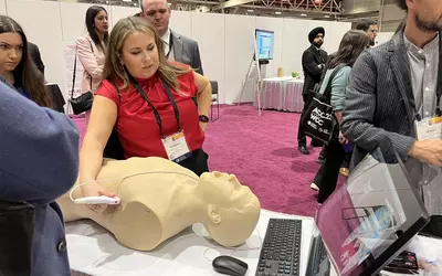 Attendees use a thoracic echocardiography training simulator at the cardiac critical care hands-on simulation area at ACC23.