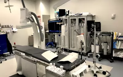 The cardiac cath lab at ambulatory surgical center (ASC) in Sun City, Arizona, operated in a partnership between Banner Health and Atlas Healthcare Partners. It features a floor mounted C-arm, storage cabinets, anesthesiology equipment, prep areas, vascular access ultrasound and a full echocardiography system that enables transesophageal echo (TEE).