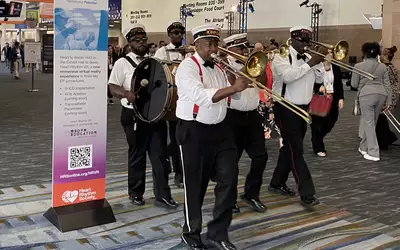 A New Orleans jazz band marches through the HRS 2023 conference. Photo by Dave Fornell