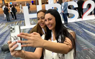 Attendees getting selfies in front of the Heart Rhythm Society logo on the first full day of Heart Rhythm 2023. The meeting is drew more than 7,700 attendee’s this year as in-person meetings return to normal following the pandemic. #HRS2023