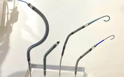 Display of Abiomed Impella percutaneous hemodynamic support pumps, from left, the Impella RP (curved to fit the right heart anatomy), Impella 5.5 and the Impella CP at TCT 2023. Photo by Dave Fornell