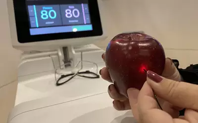 Excimer laser atherectomy system cutting through an apple as part of a demo by Philips at TCT 2023. Photo by Dave Fornell