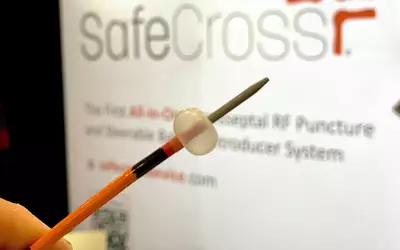 The East End Medical Safecross septal crossing system for use in structural heart and electrophysiology procedures. It is the first all-in-one transseptal RF puncture and steerable balloon introducer system to provide predictable left atrium access. The steerable catheter incorporates an integrated radio-frequency ablation tip to cut through the septum. A balloon inflates as an atraumatic buffer to push against the septal wall where the operator wants to cross. Photo by Dave Fornell