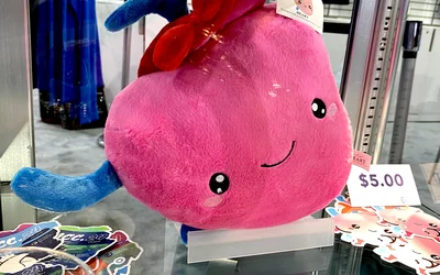 A heart plush toy was among one of the new items at the ACC store on the expo floor at ACC.24. Heart pillow happy heart in ACC store at ACC24. 