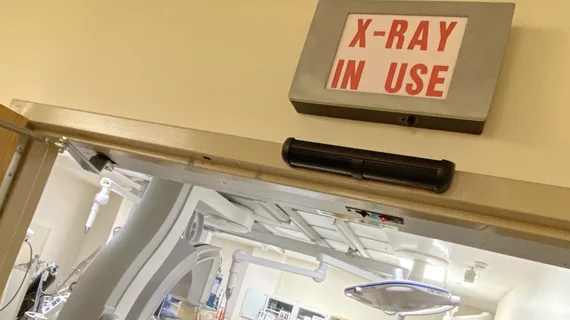 Cath Lab X-ray radiation warning sign above the door at Wellstar Kennestone Hospital. Photo by Dave Fornell