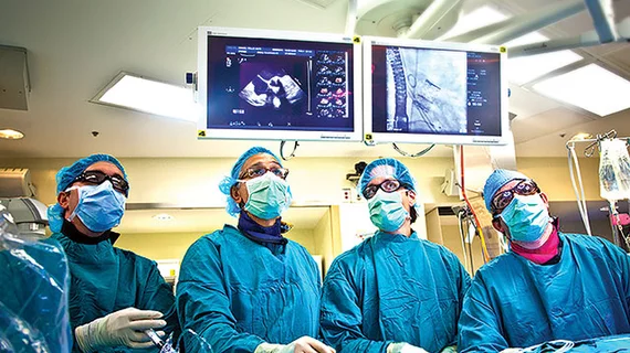 A heart team working together during a TAVR procedure at Emory. The success of the heart team approach has has made it a model for care collaborations across cardiovascular care.